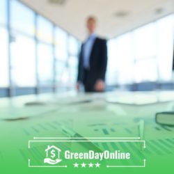 A man in a business suit walking past a glass wall going to discuss the difference between payday loans and banks or credit unions