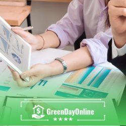 A woman sitting at a table with a tablet calculating the interest rate on a payday loan