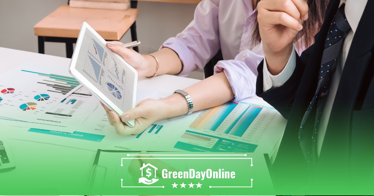 A woman sitting at a table with a tablet calculating the interest rate on a payday loan