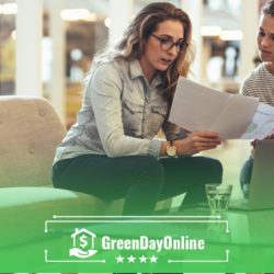 A couple of women sitting on top of a couch looking for payday loans without direct deposit