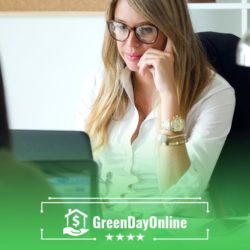 A woman sitting at a desk talking to another woman about payday loans in Oklahoma City